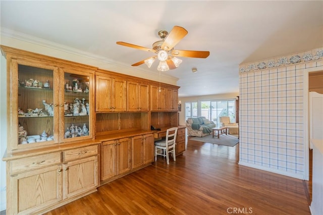 3115 Merrill Dr Unit 59, Torrance, CA 90503 - kitchen featuring dark wood-style floors, a ceiling fan, glass insert cabinets, brown cabinetry, and ornamental molding