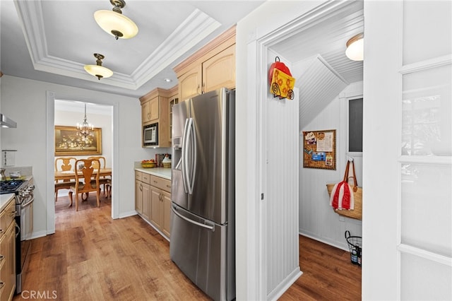 18911 Crimson Cir, Huntington Beach, CA 92646 - kitchen featuring stainless steel appliances, light countertops, wood finished floors, and a chandelier