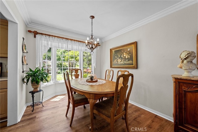 18911 Crimson Cir, Huntington Beach, CA 92646 - dining space with a chandelier, wood finished floors, and ornamental molding