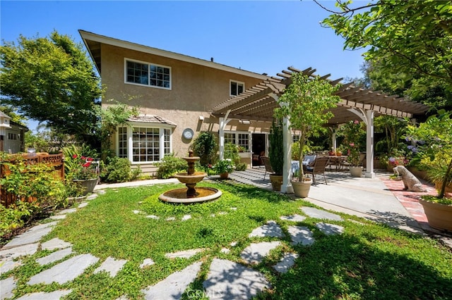 18911 Crimson Cir, Huntington Beach, CA 92646 - rear view of house featuring stucco siding, a patio area, and a pergola