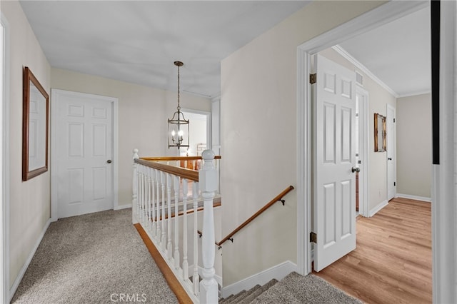 18911 Crimson Cir, Huntington Beach, CA 92646 - hallway featuring an upstairs landing and a chandelier