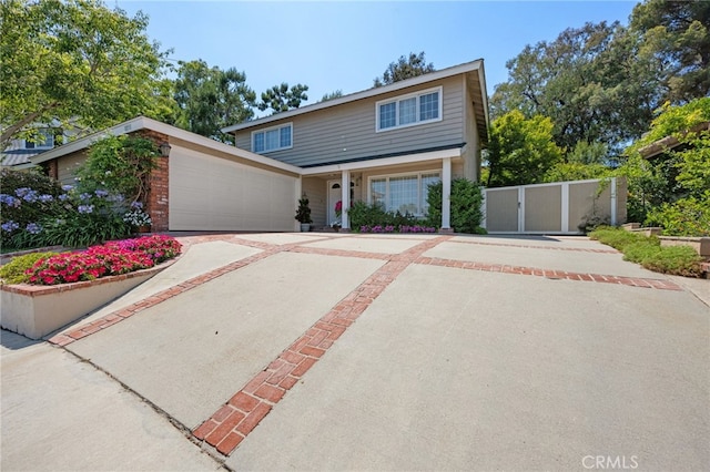 18911 Crimson Cir, Huntington Beach, CA 92646 - traditional-style home featuring a gate and a garage