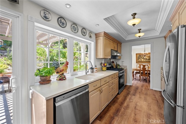 18911 Crimson Cir, Huntington Beach, CA 92646 - kitchen featuring stainless steel appliances, healthy amount of natural light, under cabinet range hood, light countertops, and crown molding