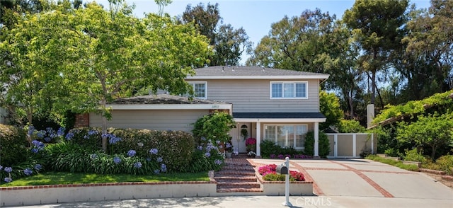 18911 Crimson Cir, Huntington Beach, CA 92646 - traditional-style home featuring concrete driveway