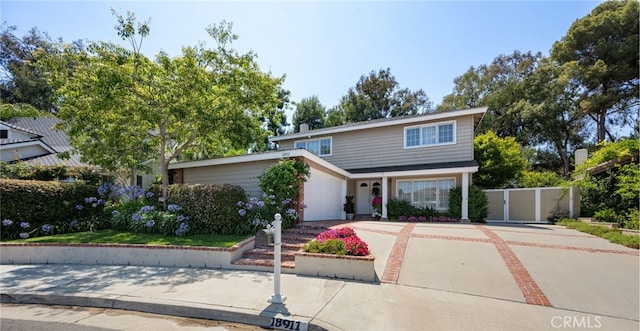 18911 Crimson Cir, Huntington Beach, CA 92646 - traditional-style house with driveway and a garage