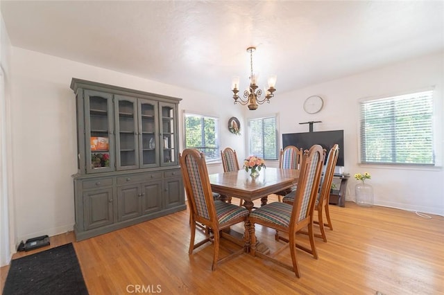 4124 Ivar Ave, Rosemead, CA 91770 - dining room featuring a chandelier and light wood finished floors