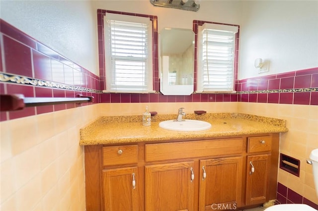 4124 Ivar Ave, Rosemead, CA 91770 - bathroom featuring tile walls, vanity, and plenty of natural light