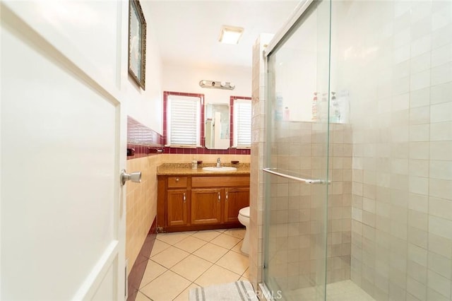 4124 Ivar Ave, Rosemead, CA 91770 - full bathroom featuring tile patterned floors, a stall shower, vanity, tile walls, and wainscoting
