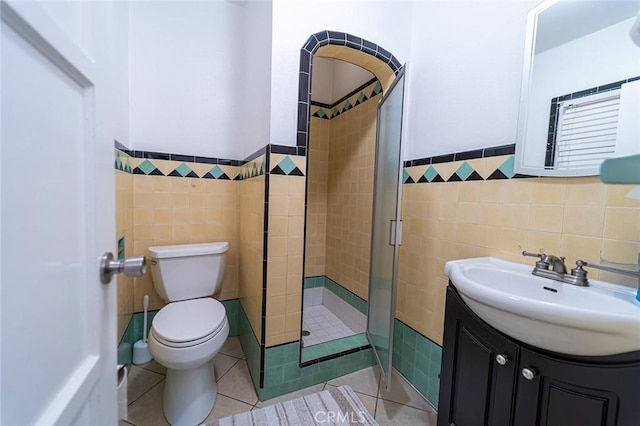 4124 Ivar Ave, Rosemead, CA 91770 - full bathroom with tile walls, a stall shower, vanity, a wainscoted wall, and tile patterned flooring