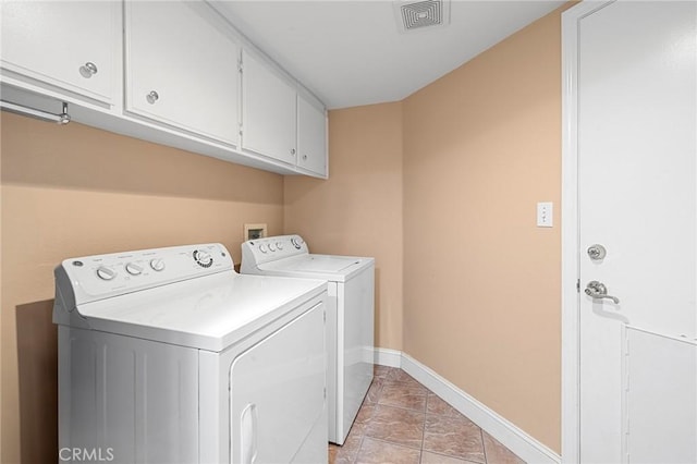 3143 Tourmaline Ln, Palmdale, CA 93550 - washroom featuring cabinet space, washing machine and clothes dryer, and light tile patterned floors