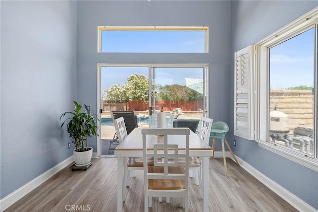 3143 Tourmaline Ln, Palmdale, CA 93550 - dining space with wood finished floors and a high ceiling