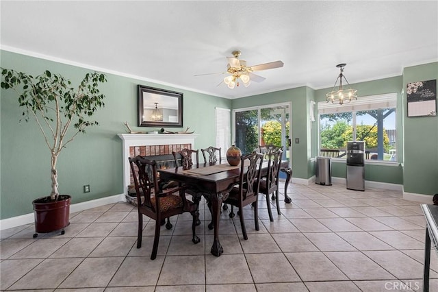 3143 Tourmaline Ln, Palmdale, CA 93550 - dining space with plenty of natural light, ceiling fan, light tile patterned flooring, and crown molding