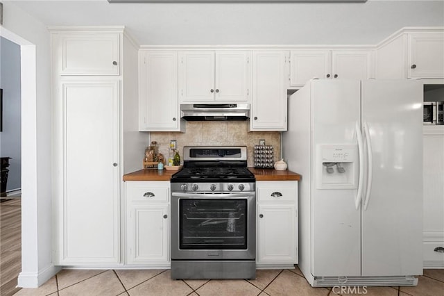 3143 Tourmaline Ln, Palmdale, CA 93550 - kitchen featuring white refrigerator with ice dispenser, stainless steel range with gas cooktop, under cabinet range hood, white cabinets, and light tile patterned floors