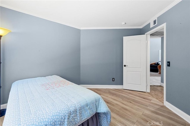 3143 Tourmaline Ln, Palmdale, CA 93550 - bedroom featuring light wood finished floors and ornamental molding