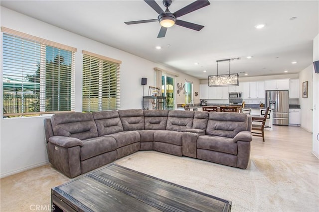 1180 Little Leaf, Calimesa, CA 92320 - living room featuring light colored carpet, healthy amount of natural light, a ceiling fan, and recessed lighting