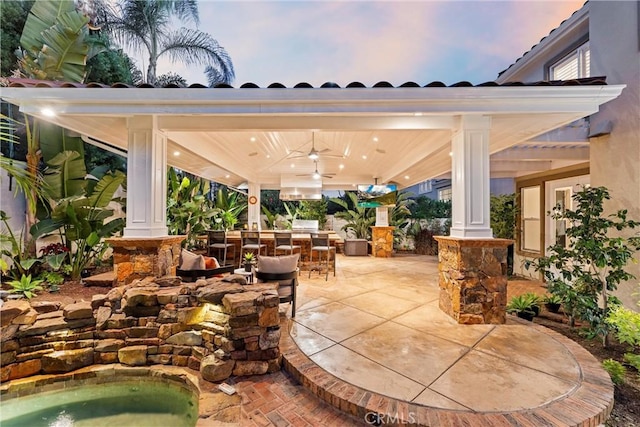 2175 Palmer Pl, Tustin, CA 92782 - patio terrace at dusk with a ceiling fan, a patio, and an outdoor bar