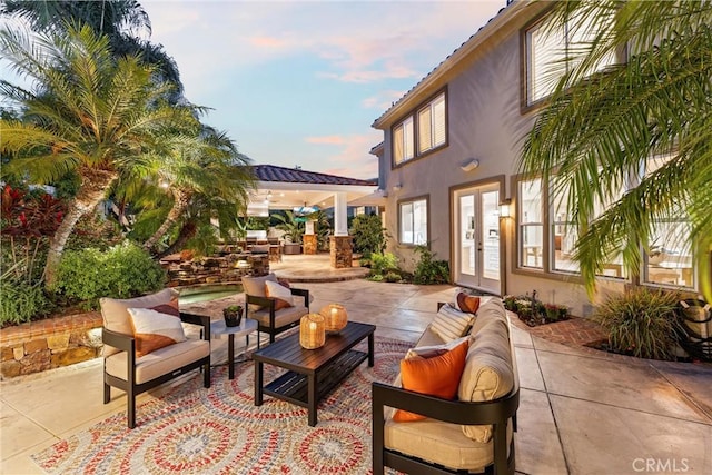 2175 Palmer Pl, Tustin, CA 92782 - patio terrace at dusk with french doors, outdoor lounge area, a patio, and a gazebo