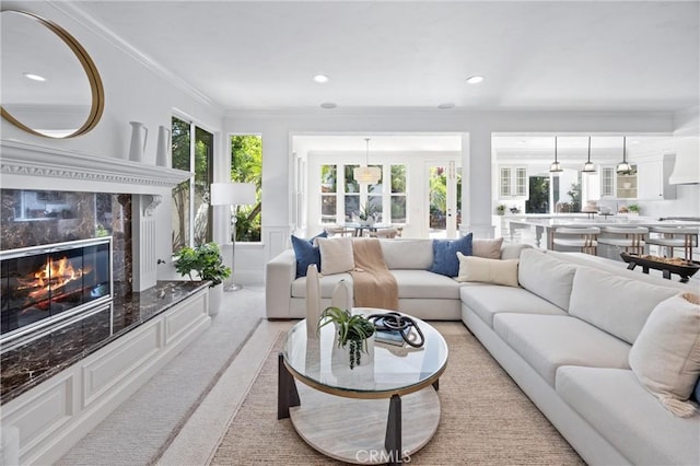 2175 Palmer Pl, Tustin, CA 92782 - living room featuring a fireplace, ornamental molding, recessed lighting, and light colored carpet