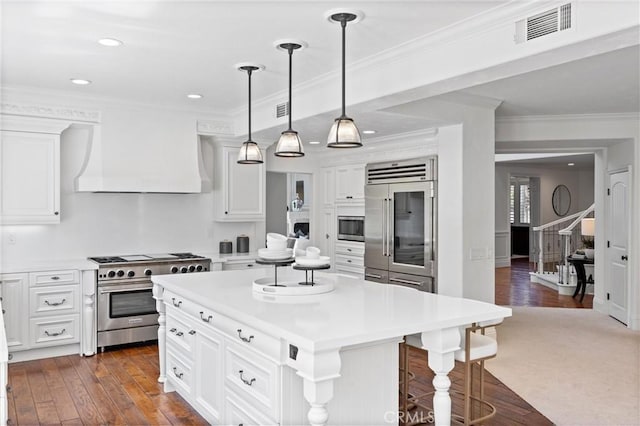 2175 Palmer Pl, Tustin, CA 92782 - kitchen featuring built in appliances, custom range hood, white cabinetry, light countertops, and recessed lighting