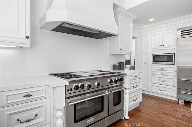 2175 Palmer Pl, Tustin, CA 92782 - kitchen featuring built in appliances, premium range hood, white cabinetry, light countertops, and recessed lighting