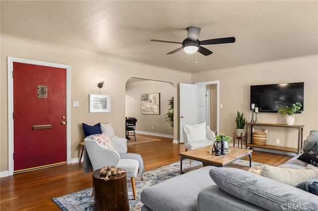 1168 Laburnum Ave, Chico, CA 95926 - living area with arched walkways, ceiling fan, and wood finished floors