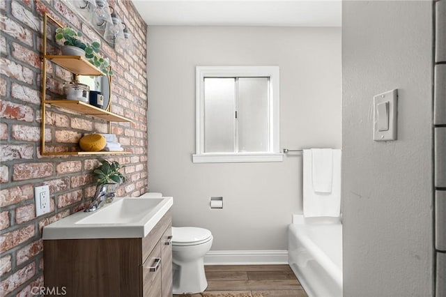 1168 Laburnum Ave, Chico, CA 95926 - full bathroom featuring vanity, wood finished floors, and a tub