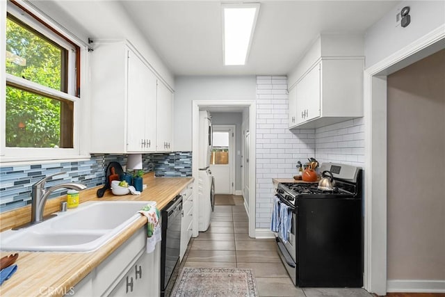 1168 Laburnum Ave, Chico, CA 95926 - kitchen with stainless steel gas range, black dishwasher, plenty of natural light, and light countertops
