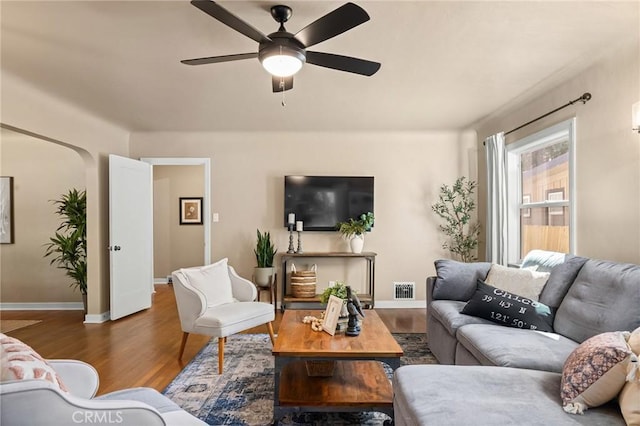 1168 Laburnum Ave, Chico, CA 95926 - living area featuring wood finished floors, ceiling fan, and arched walkways