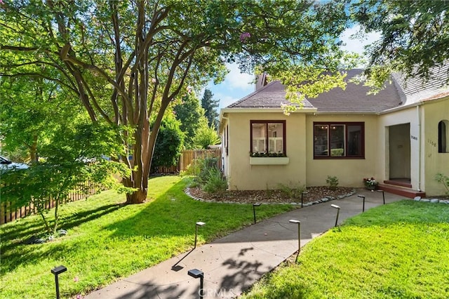 1168 Laburnum Ave, Chico, CA 95926 - view of home's exterior featuring stucco siding and a shingled roof
