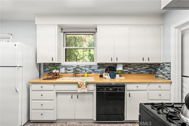 1168 Laburnum Ave, Chico, CA 95926 - kitchen with black dishwasher, freestanding refrigerator, and light countertops