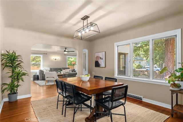 1168 Laburnum Ave, Chico, CA 95926 - dining area with arched walkways, ceiling fan, and wood finished floors