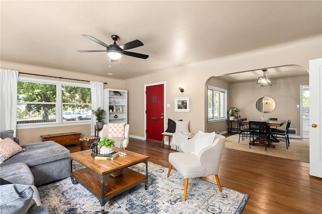 1168 Laburnum Ave, Chico, CA 95926 - living room featuring arched walkways, a ceiling fan, and healthy amount of natural light