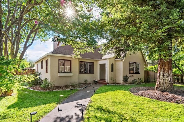 1168 Laburnum Ave, Chico, CA 95926 - view of front facade with stucco siding, a shingled roof, and a chimney