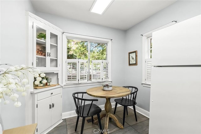 1168 Laburnum Ave, Chico, CA 95926 - dining area featuring baseboards and dark tile patterned floors