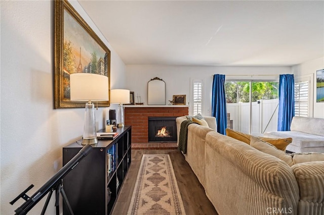 1007 Flintlock Rd, Diamond Bar, CA 91765 - living room with dark wood-style floors and a fireplace
