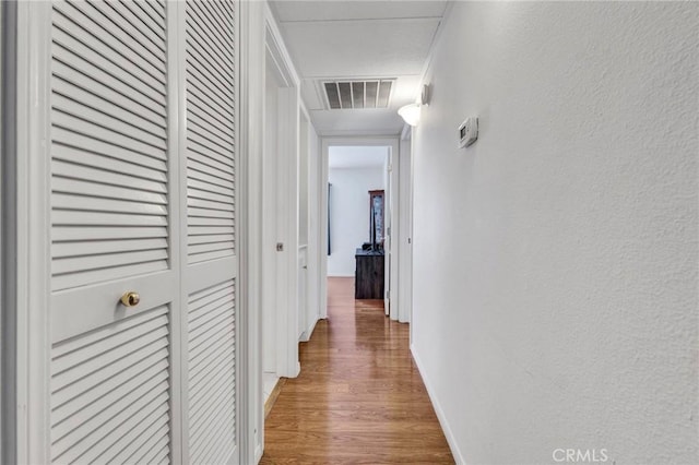 26966 Flo Ln Unit 319, Canyon Country, CA 91351 - corridor featuring wood finished floors and a textured wall