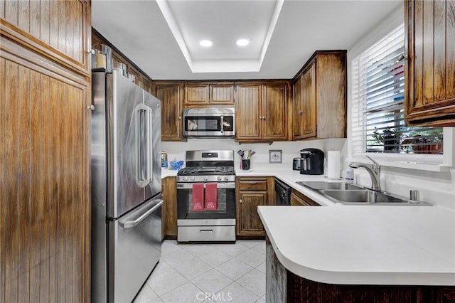 26966 Flo Ln Unit 319, Canyon Country, CA 91351 - kitchen featuring stainless steel appliances, light tile patterned floors, a tray ceiling, light countertops, and recessed lighting