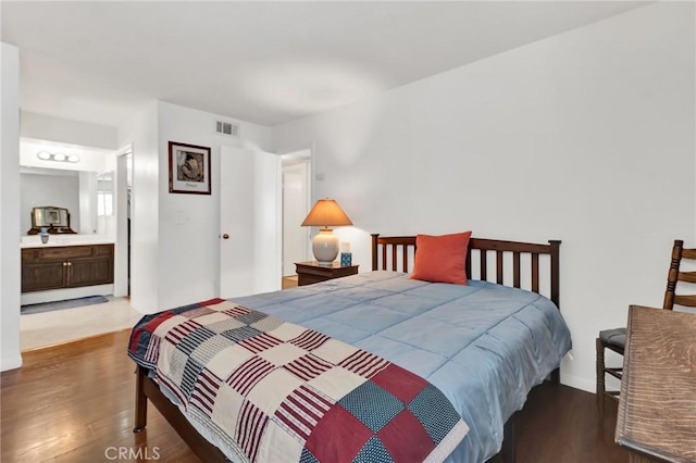 26966 Flo Ln Unit 319, Canyon Country, CA 91351 - bedroom featuring wood finished floors and ensuite bath