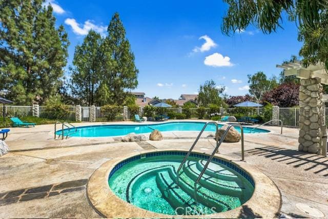 26966 Flo Ln Unit 319, Canyon Country, CA 91351 - community pool featuring a hot tub and a patio