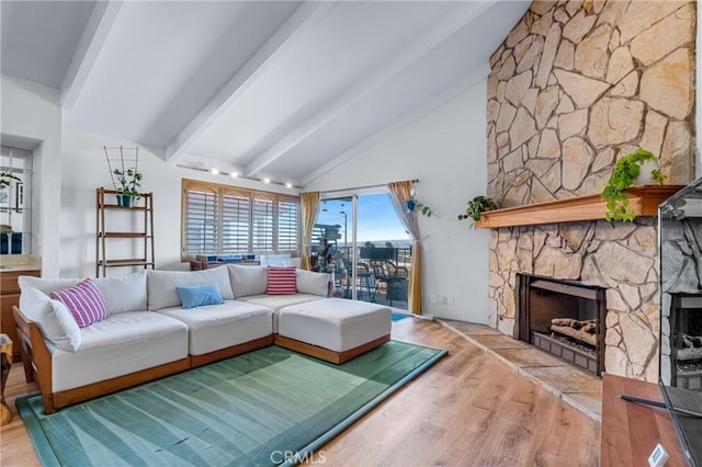 2433 S Gaffey St, San Pedro, CA 90731 - living area featuring wood finished floors, a stone fireplace, beamed ceiling, and high vaulted ceiling