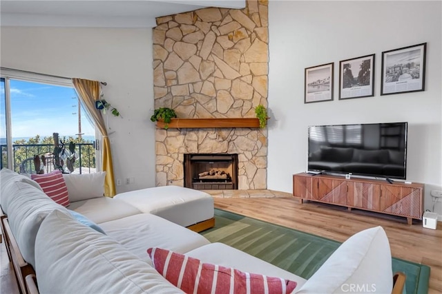 2433 S Gaffey St, San Pedro, CA 90731 - living room featuring wood finished floors, a fireplace, and high vaulted ceiling