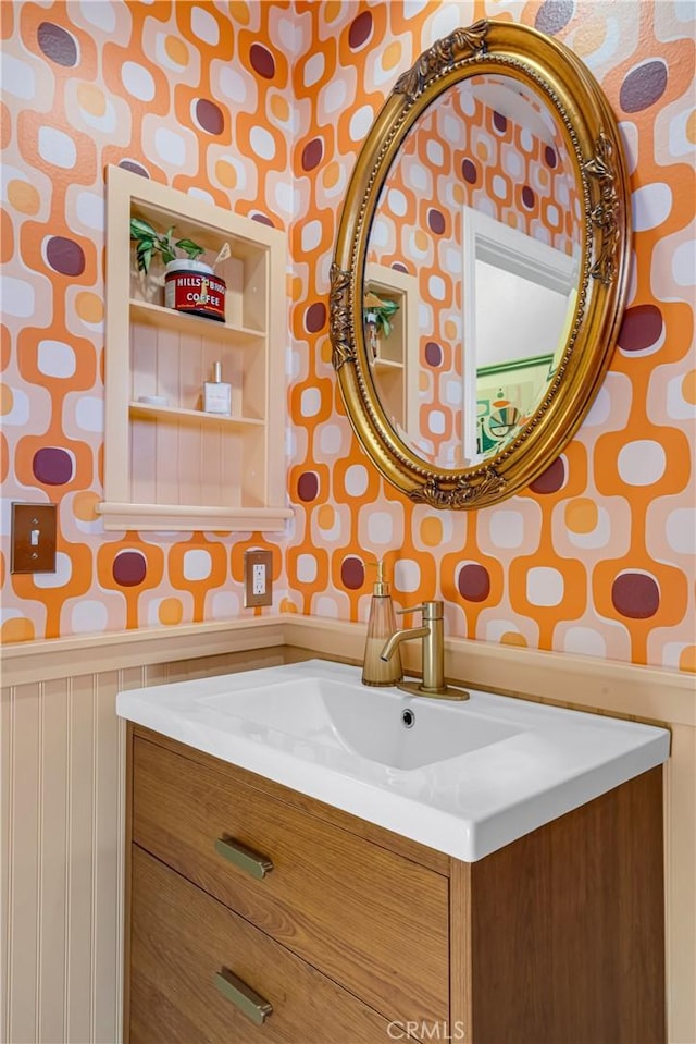 2433 S Gaffey St, San Pedro, CA 90731 - bathroom featuring wallpapered walls, vanity, and wainscoting