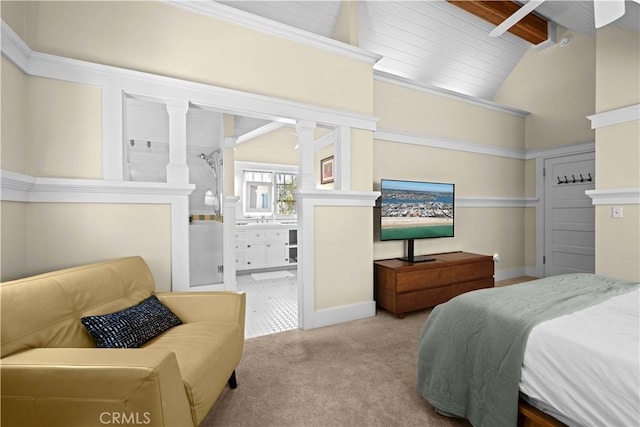 6025 E Ocean Blvd, Long Beach, CA 90803 - carpeted bedroom with ornate columns and ensuite bath