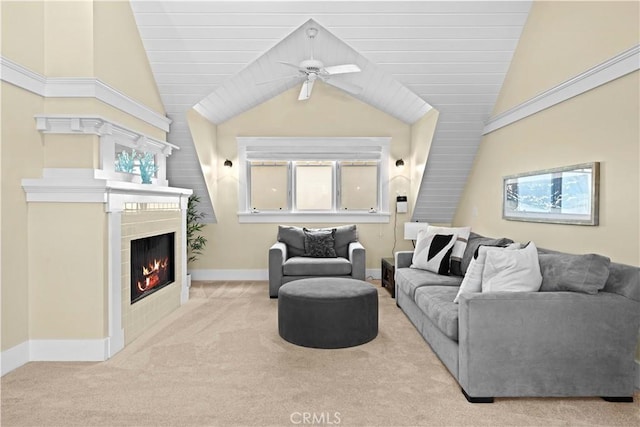 6025 E Ocean Blvd, Long Beach, CA 90803 - living area with carpet floors, a tile fireplace, lofted ceiling, ceiling fan, and plenty of natural light