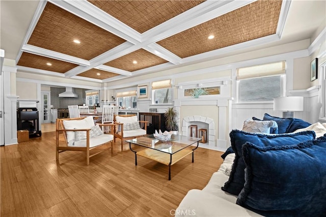 6025 E Ocean Blvd, Long Beach, CA 90803 - living area featuring a fireplace with flush hearth, coffered ceiling, light wood-style flooring, beamed ceiling, and wainscoting