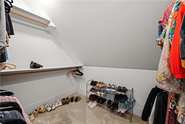 6025 E Ocean Blvd, Long Beach, CA 90803 - walk in closet featuring carpet floors and vaulted ceiling