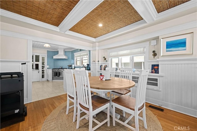 6025 E Ocean Blvd, Long Beach, CA 90803 - dining space with light wood-type flooring, ornamental molding, and coffered ceiling