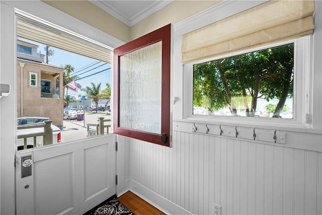 6025 E Ocean Blvd, Long Beach, CA 90803 - doorway to outside featuring healthy amount of natural light, crown molding, and wood finished floors