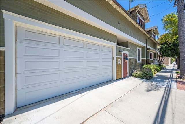6025 E Ocean Blvd, Long Beach, CA 90803 - garage featuring concrete driveway