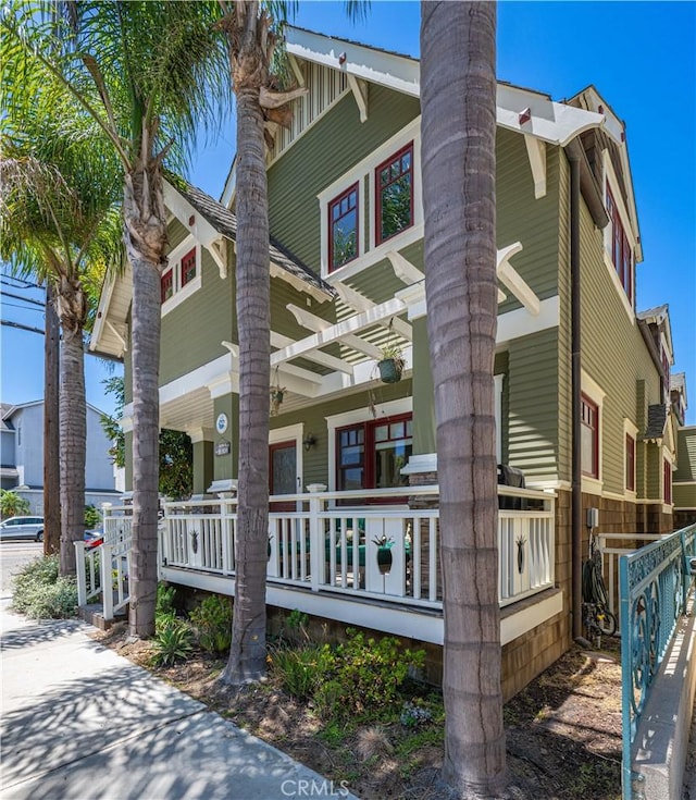 6025 E Ocean Blvd, Long Beach, CA 90803 - view of side of property featuring covered porch